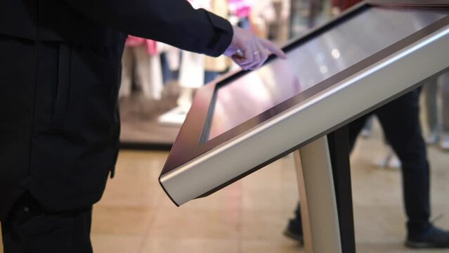 Man looking for information and location of shopping place on digital device
