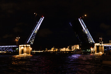 Fototapeta na wymiar Opening purple bridges in St. Petersburg at night in Russia
