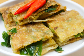 Martabak Telor or Martabak Telur. Savory pan-fried pastry stuffed with egg, meat and spices. Martabak Telur is one of Indonesia street food