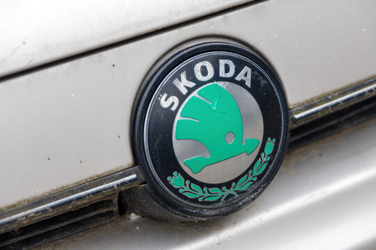 Novi Sad, Serbia - February 5, 2024: Old Skoda logo on worn white vehicle. Czech automobile manufacturer is now part of Volkswagen Group.