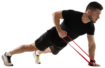 Muscular sportive man training, standing in plank positing and doing exercises with fitness band isolated on transparent background. Concept of sport, fitness, workout, healthy and active lifestyle