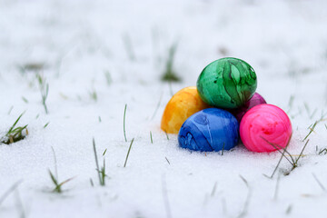 Colorful easter eggs in snow