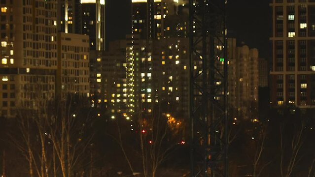 Skyscraper lights in night city, time lapse