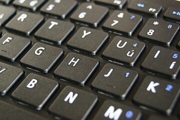 Fragment of a new black keyboard. Close-up. High quality photo