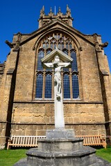 Front view of St Marys Minster Church in the town centre with the war memorial and crucifix in the foreground, Ilminster, Somerset, UK, Europe. - 734962449