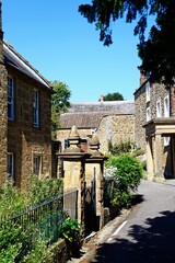 Traditional hamstone buildings along Court Barton in the old town, Ilminster, Somerset, UK, Europe.