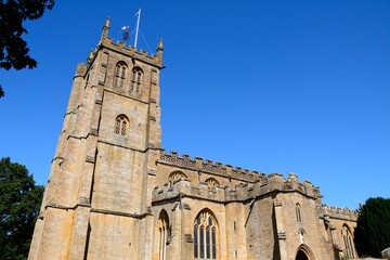 View of All Saints church along Church Street, Martock, Somerset, UK, Europe. - 734964232