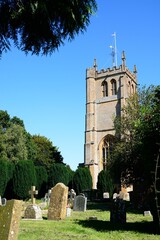 View of All Saints church tower and graveyard, Martock, Somerset, UK, Europe. - 734964428