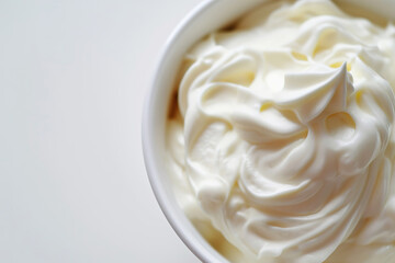 Obraz na płótnie Canvas Fresh Greek Yogurt in White Bowl Top View