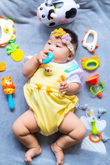Baby in cute outfit with toys,Little girl 3-6 months old in cute outfits
