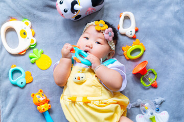 Baby in cute outfit with toys,Little girl 3-6 months old in cute outfits