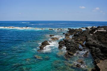 Beautiful rocks and turquoise sea on the coast of the Canary Islands, Tenerife Spain