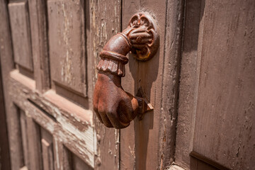 A traditional hand knocker on a door in San Cristobal de La Laguna, Tenerife, Spain