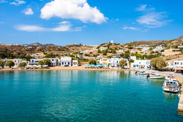 View of Kimolos port with white houses and sea bay, Kimolos island, Cyclades, Greece