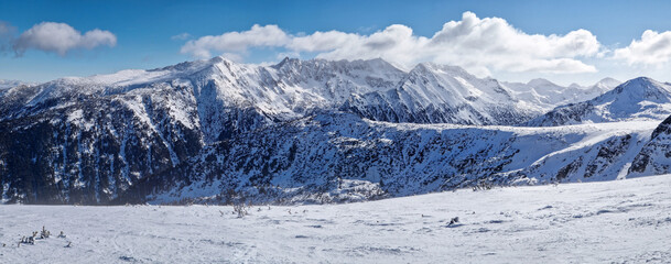 Beautiful panorama of balkan mountains ridge. Rocky peaks covered with snow in Bulgaria
