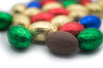 closeup of chocolate easter eggs on white background - 734984230