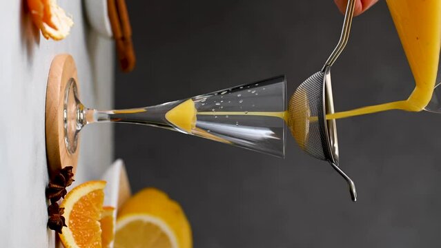 Preparing immune boosting drink. Ginger, orange, turmeric shot.