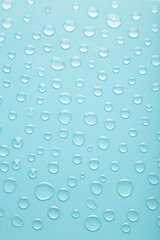 Water drops on blue background. Space for text