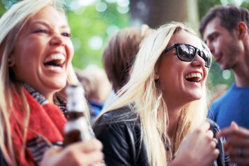 Happy, drinks and women at music festival, concert or party laughing, excited and enjoy outdoor...