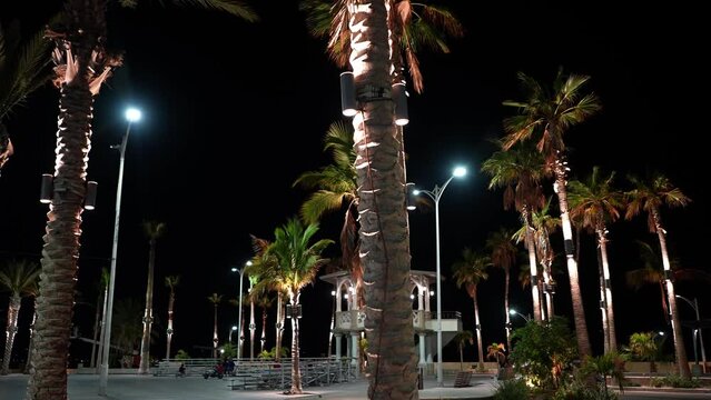 Night view of a large two story gazebo in the center of the malecon in La Paz, Mexico on Baja California Sur.