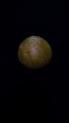 Obraz na płótnie Canvas grapefruit on a black background