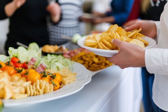 person serving snacks during a seminar break time