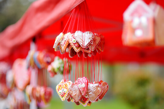 Colorful licitar gingerbreads with small mirror sold on outdoor Easter Europe holiday market. Home made sweets and cookies selling on traditional urban weekend fair.