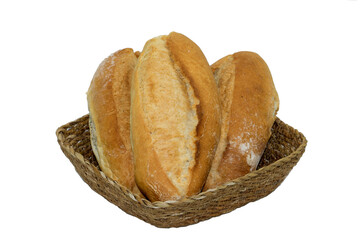 Fresh crusty loaf breakfast breads in a basket