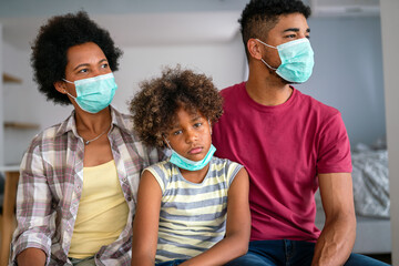 Family is wearing facemasks during coronavirus and flu outbreak. Virus and illness protection, COVID