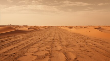 Asphalt road covered with sand in the desert after a sandstorm. - obrazy, fototapety, plakaty