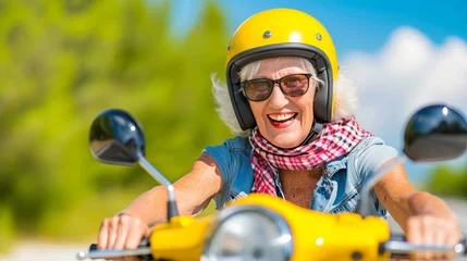 Poster Happy senior woman on yellow scooter in italy, enjoying summer vacation and trendy bike road trip © Ilja