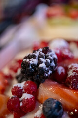 Japanese pancake with lots of fruit and syrup sauce in a restaurant in close-up,