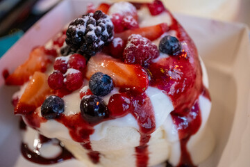 Japanese pancake with lots of fruit and syrup sauce in a restaurant in close-up,