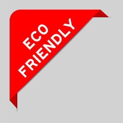Red color of corner label banner with word eco friendly on gray background
