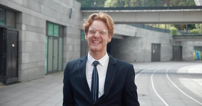 Man in elegant suit beams with joy success radiating in big smile in close-up shoot Elation is result of hard-earned success. Each expression of happiness is intertwined with his success story.