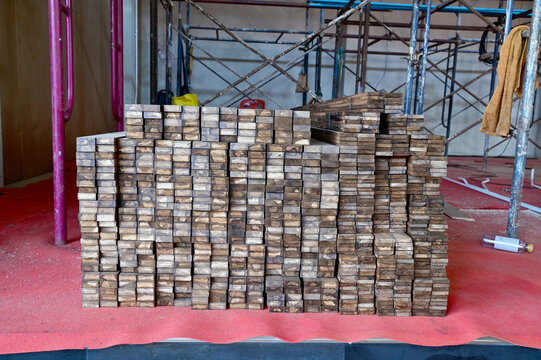 Closeup of Many piles of processed lumber inside construction site background at Thailand.