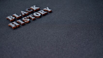 Inscription text Black History Month on dark grey isolated background close up. Celebrating the African American Conceptual Holiday for Equality