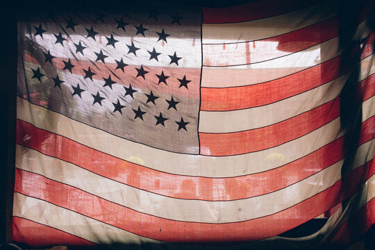 A faded american flag hangs in the window of a diner near Nashville, Tennessee