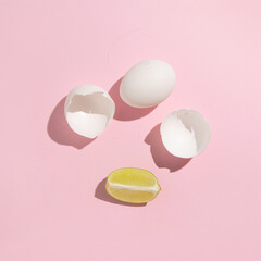 Egg shells and lemon slices, creative food composition, recipe for egg and lemon cream.