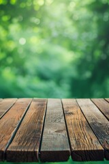 Focus on a textured wooden table with a soft, bokeh greenery background.