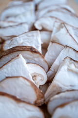Chopped Shiitake mushrooms on board on wooden restaurant table
