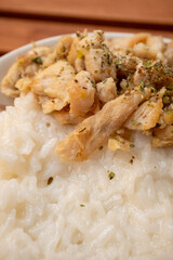 Asian style local chicken steak in white rice served with chopsticks and soy sauce