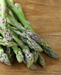 organic fresh green asparagus on wooden table