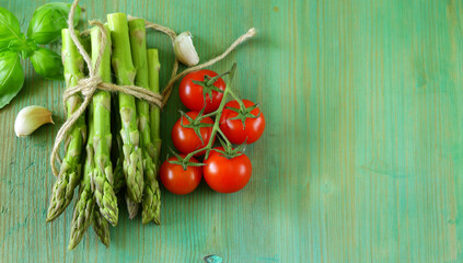 organic fresh green asparagus on wooden table