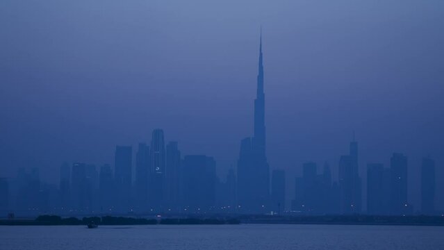timelapse from evening to night, burj khalifa view, cityscape view in dubai, uae, skyscraper, night city, sunset