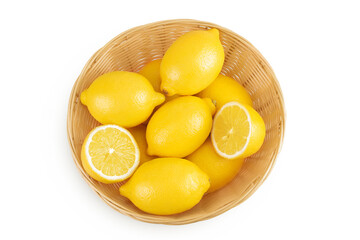 Ripe lemons in wicker basket isolated on white background. Top view. Flat lay.