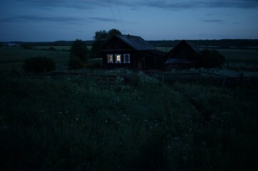 lonely house on a summer night village fence window grass