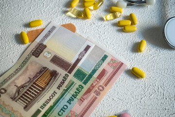 Vitamin pills, band-aids, belarus money and medicines,