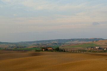 Fototapeta na wymiar A panoramic view over the hills of Tuscany in autumn, Italy. 