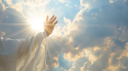 Foto auf Leinwand Spiritual Awakening: Hand Reaching for the Sunlight Through Clouds - Symbol of Hope, Faith, and Enlightenment © Michael
